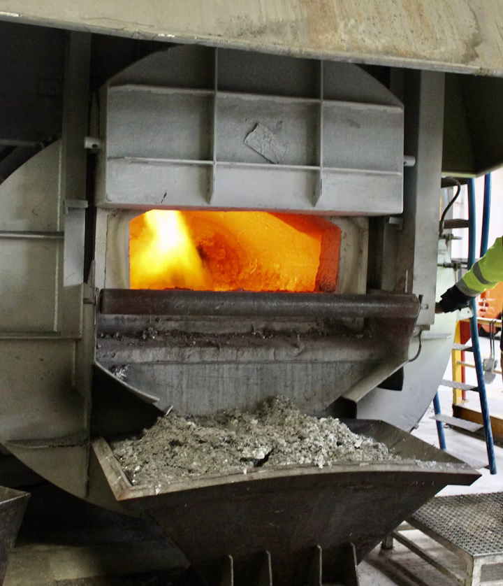 Technician monitoring hot work safety procedures in an industrial plant.