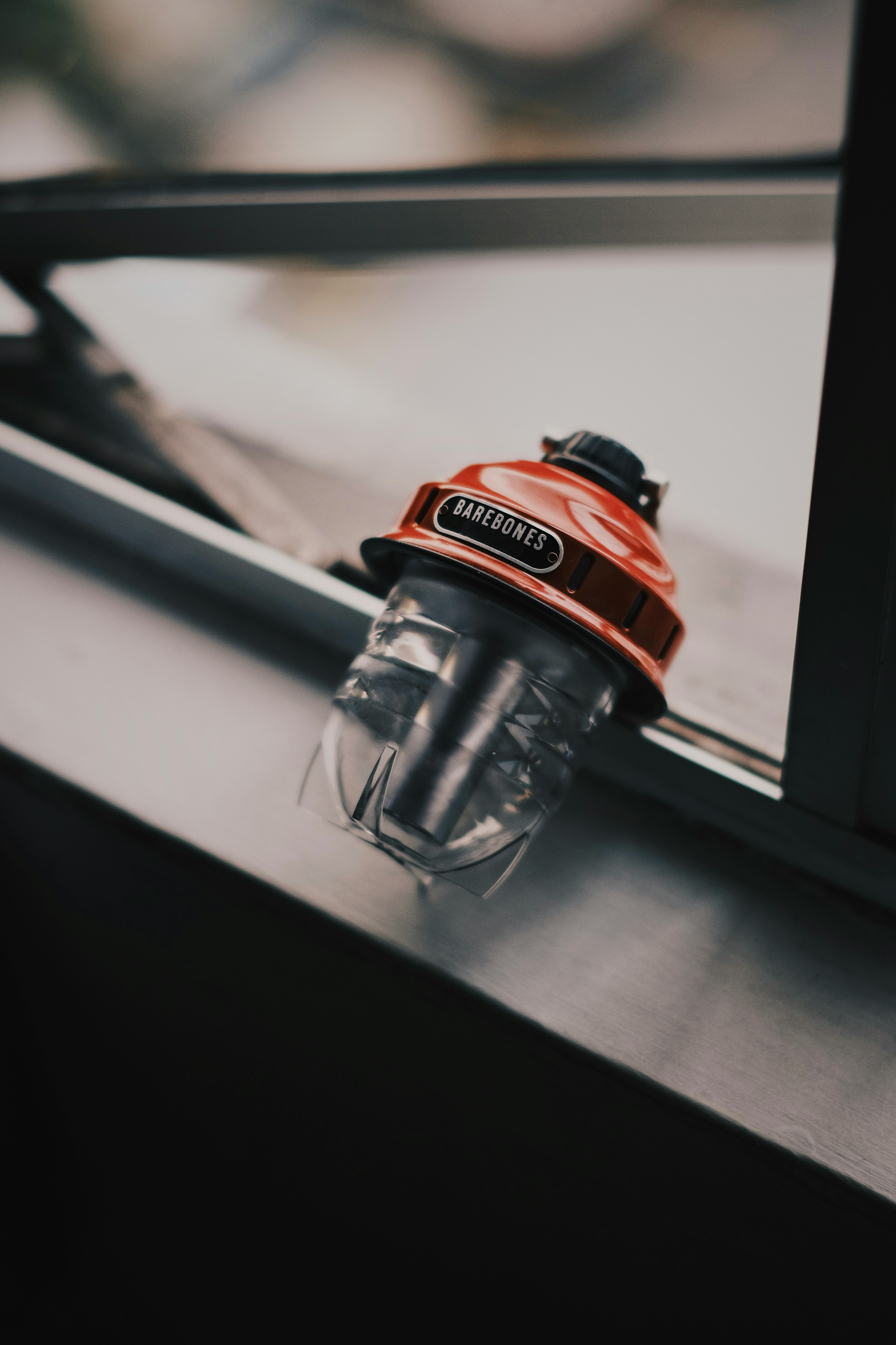 A vigilant firefighter in full gear inspecting a sprinkler system in an industrial setting.
